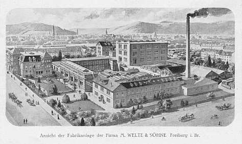 Ansicht der Fabrikanlage in Freiburg im Stühlinger. Im Hintergrund links das Münster.